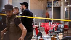 Bomb blast at Damascus cafe kills nine, Syrian state media say