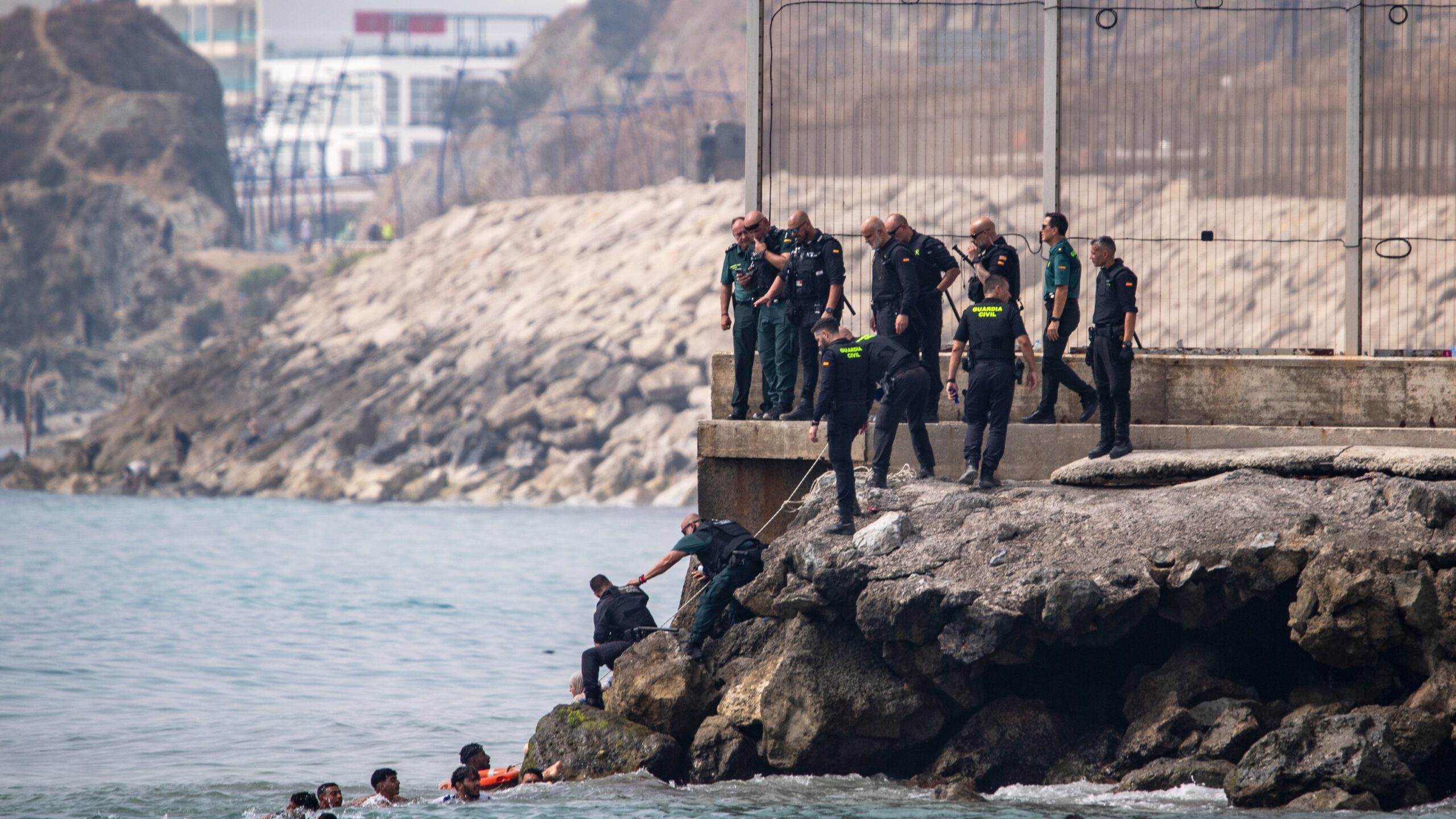 Thousands of people break through border separating Morocco from Spain’s Ceuta